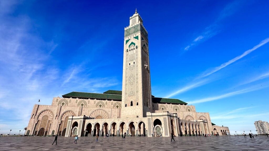 The Tsukuba Islamic Culture Exchange 2024: A Shahada From Our Japanese Sister at The End of The Event Wide-angle view of the iconic Hassan II Mosque in Casablanca under a clear blue sky.